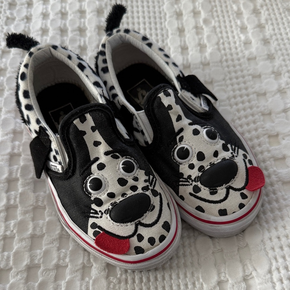 Vans Kids Dalmatian Slip-On Sneakers in Black and White with Red Tongue Accent